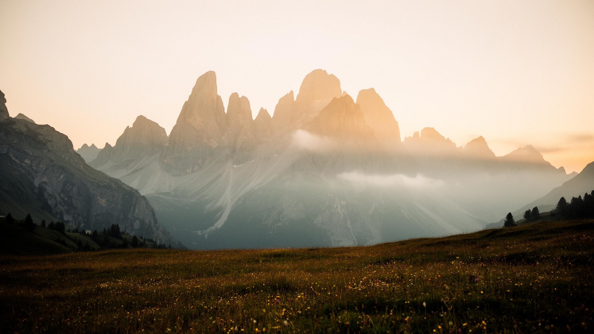 Misty Dolomite peaks at golden hour